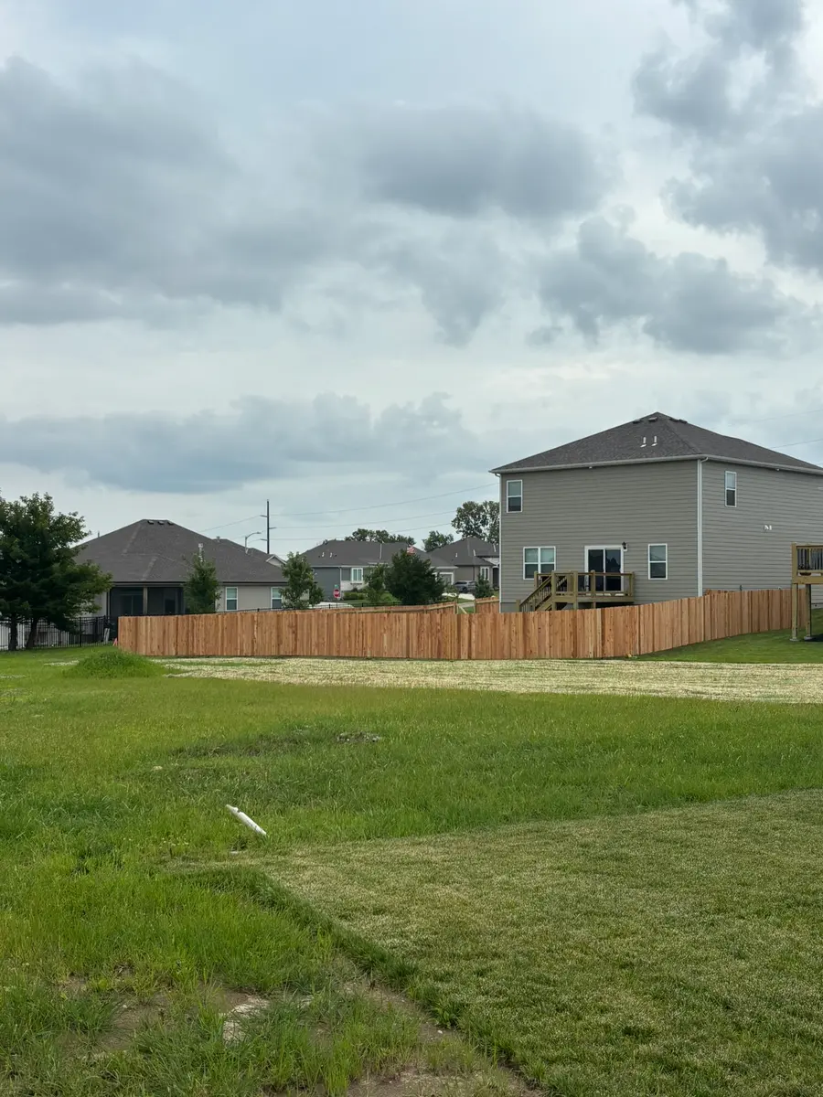 Cedar privacy fence installed on a new construction home lot by RKC Wood Care Pros