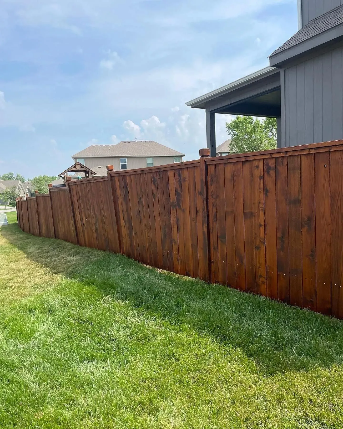 Cedar privacy fence with stained finish in Overland Park, KS — RKC Wood Care Pros