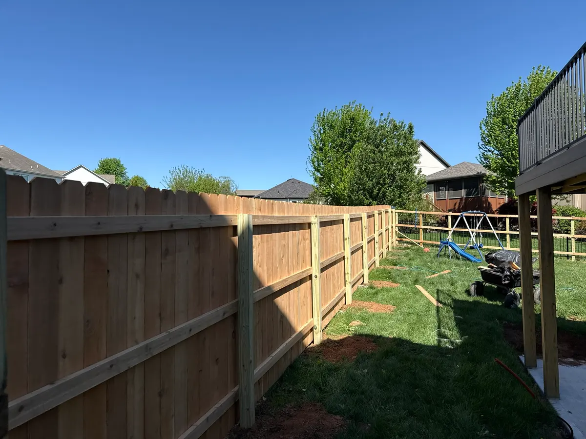 Cedar privacy fence installation in progress with posts set in concrete by RKC Wood Care Pros