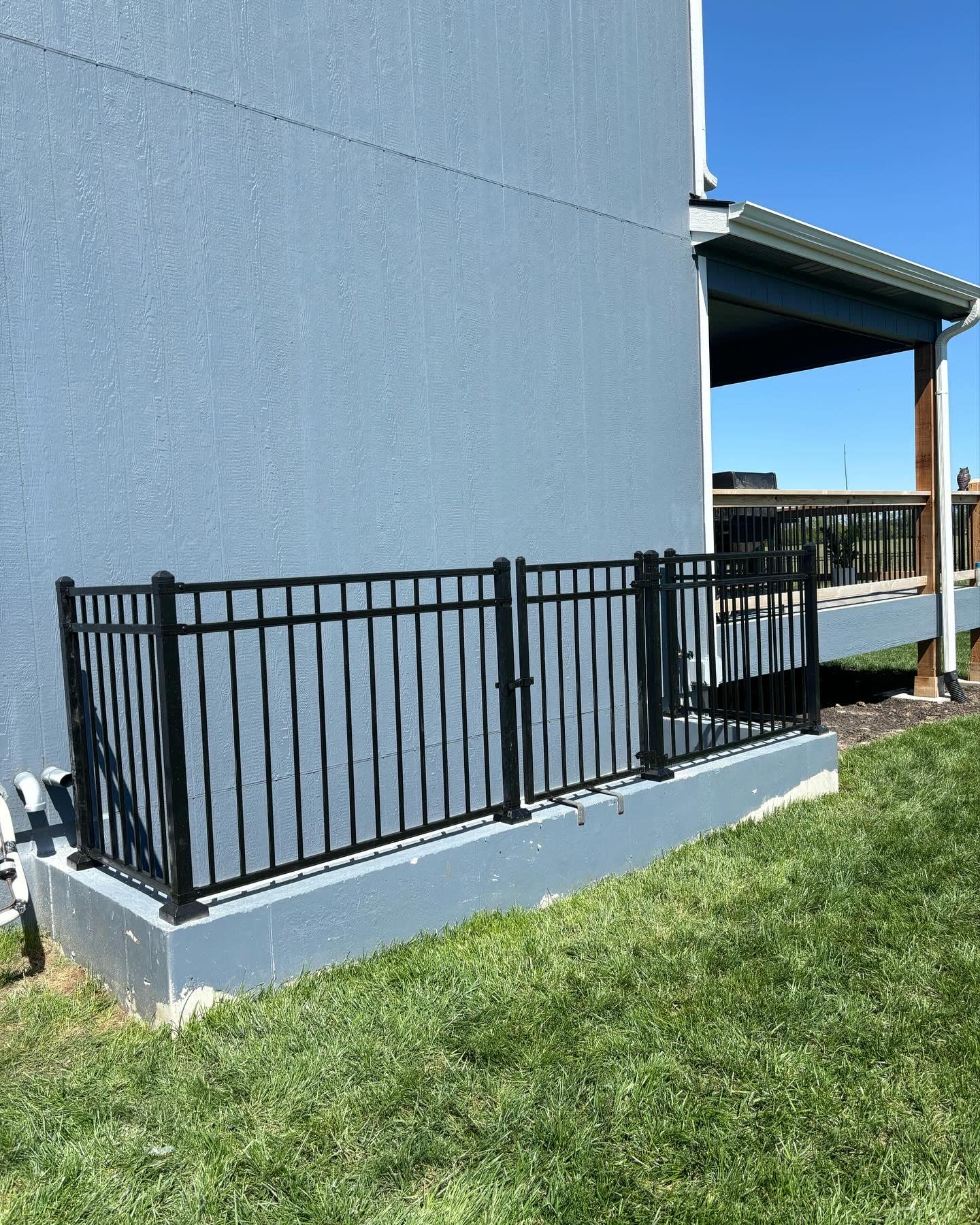 Aluminum front-yard fence in Raymore, MO by RKC Wood Care Pros