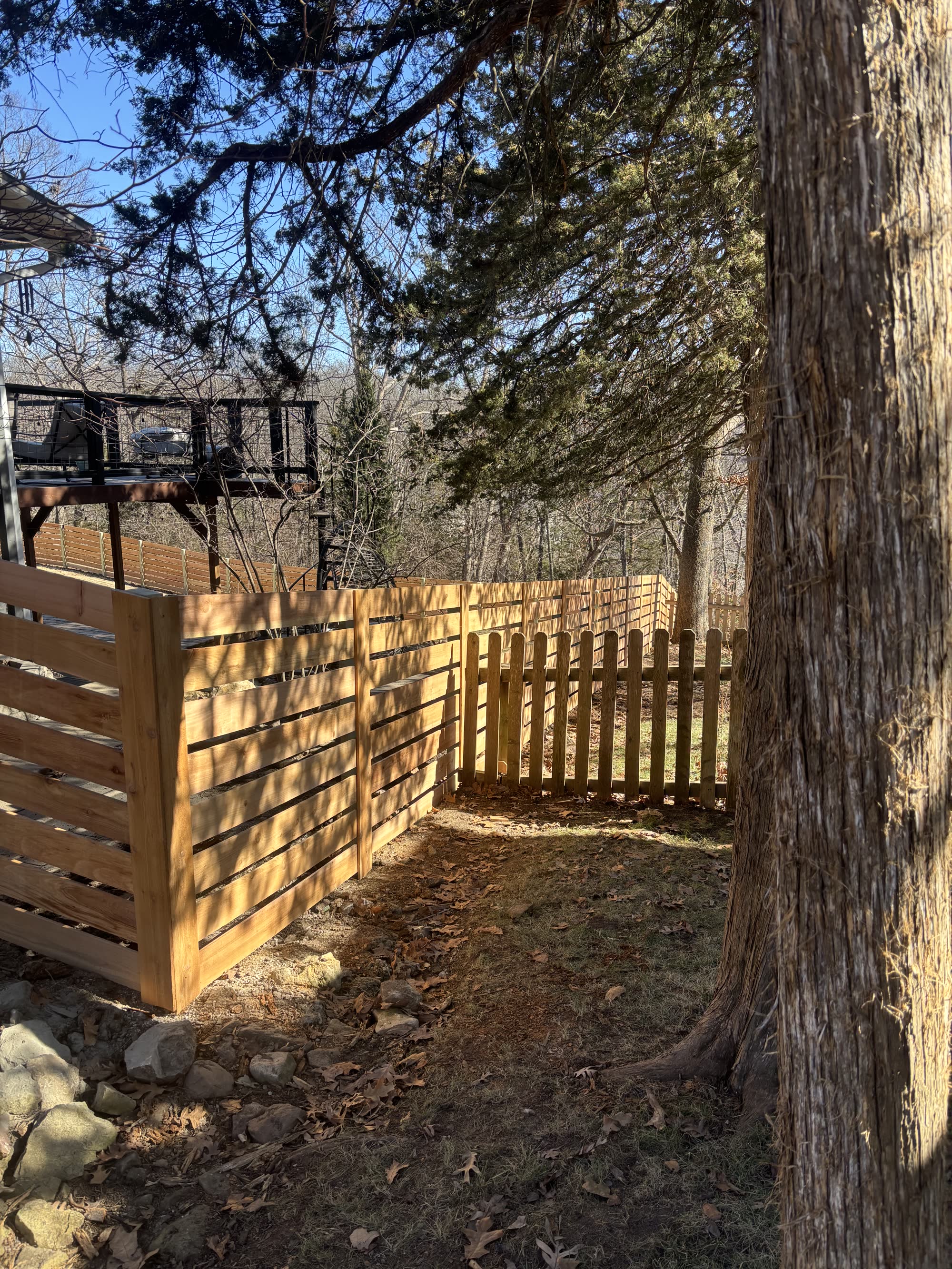 HOA-approved cedar privacy fence in an Olathe subdivision installed by RKC Wood Care Pros