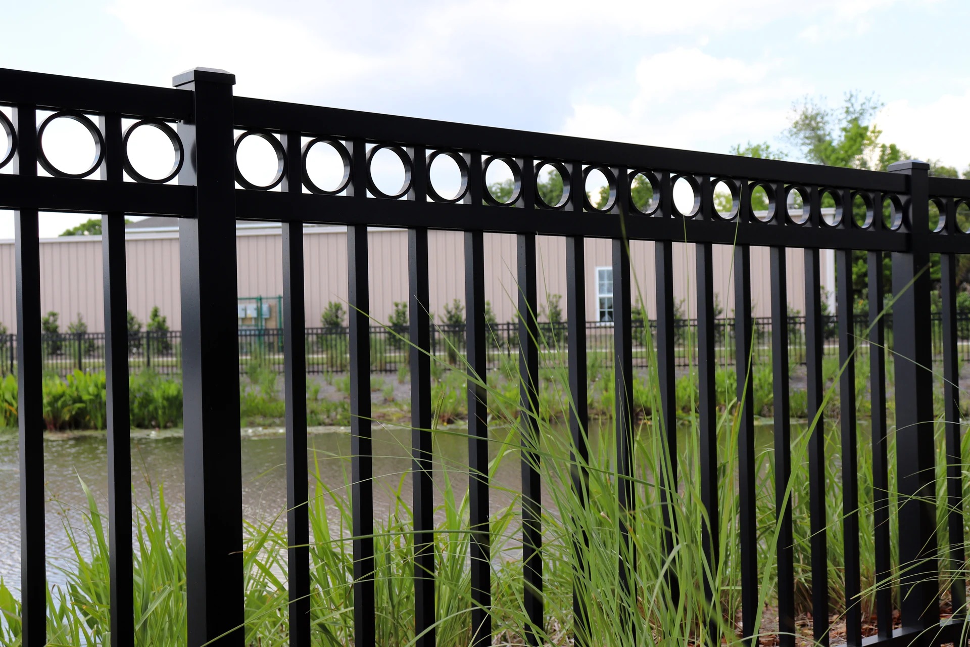 Powder-coated steel ornamental fence with spear-top finials installed in Kansas City — RKC Wood Care Pros