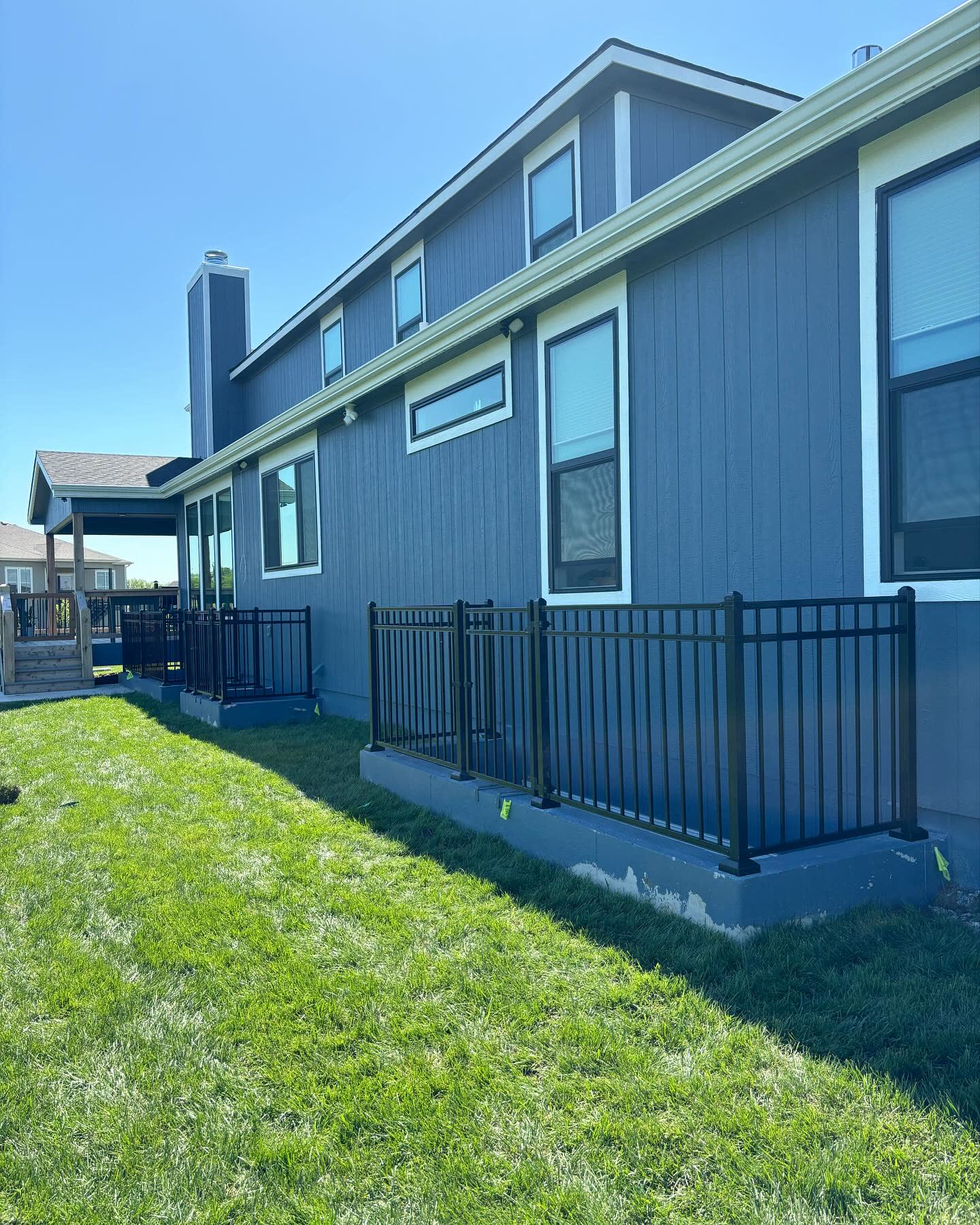 Three-rail powder-coated aluminum ornamental fence in Olathe, KS — RKC Wood Care Pros