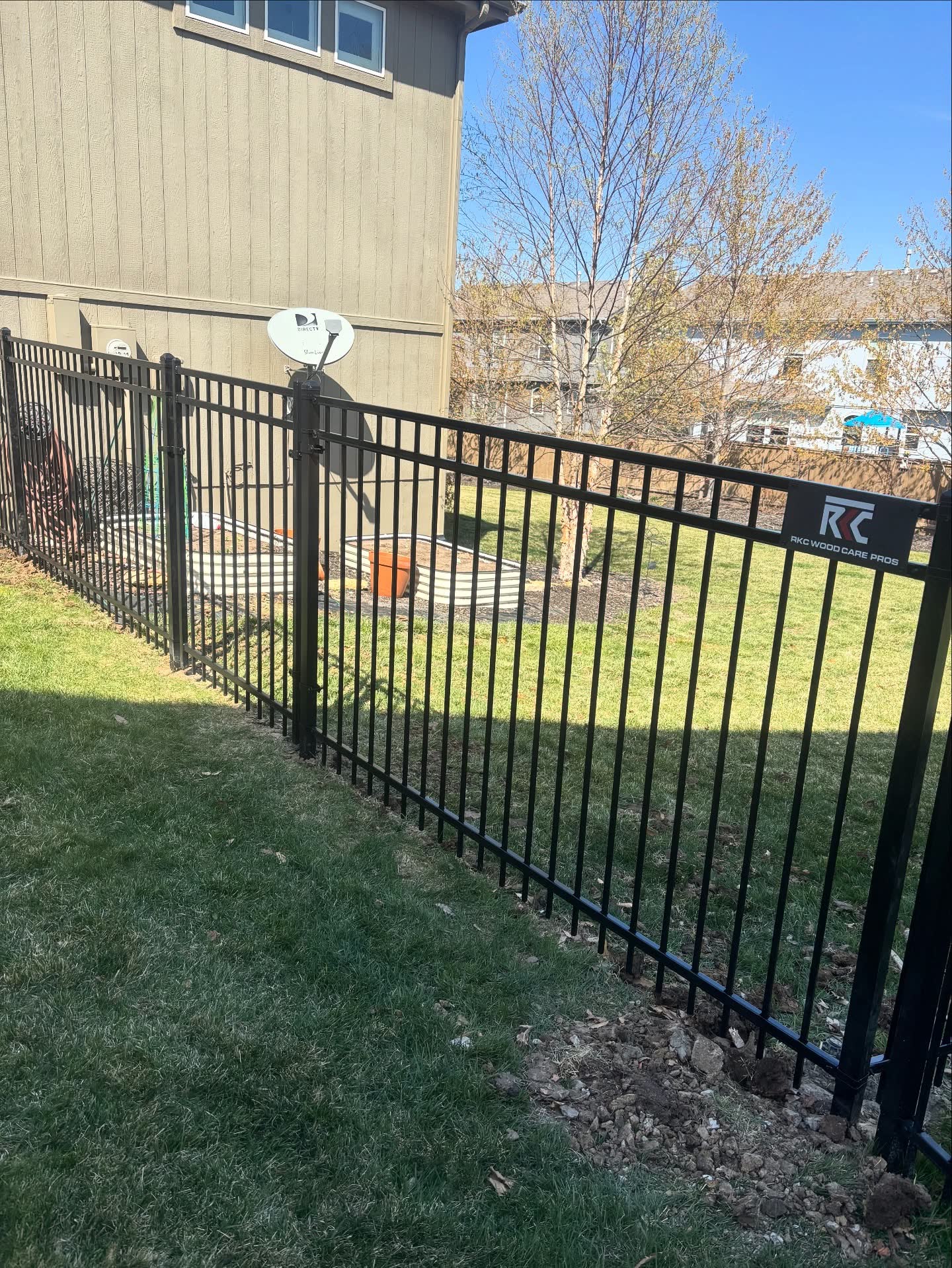 Welded aluminum ornamental fence with E-coat rust prevention in Lee's Summit, MO — RKC Wood Care Pros
