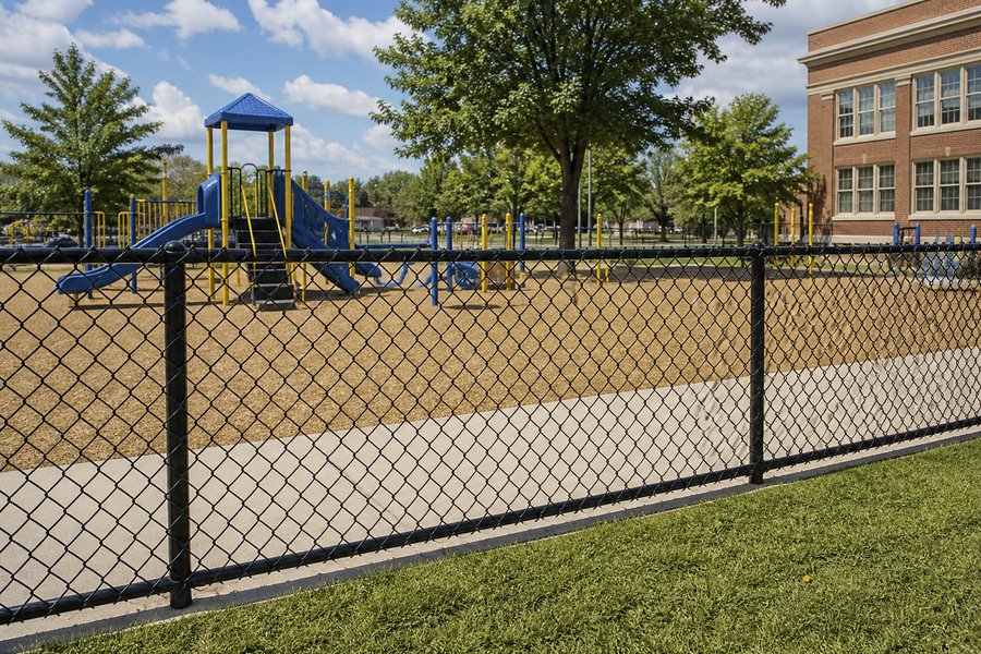 Vinyl-coated chain link install on rental property in Grandview by RKC Wood Care Pros