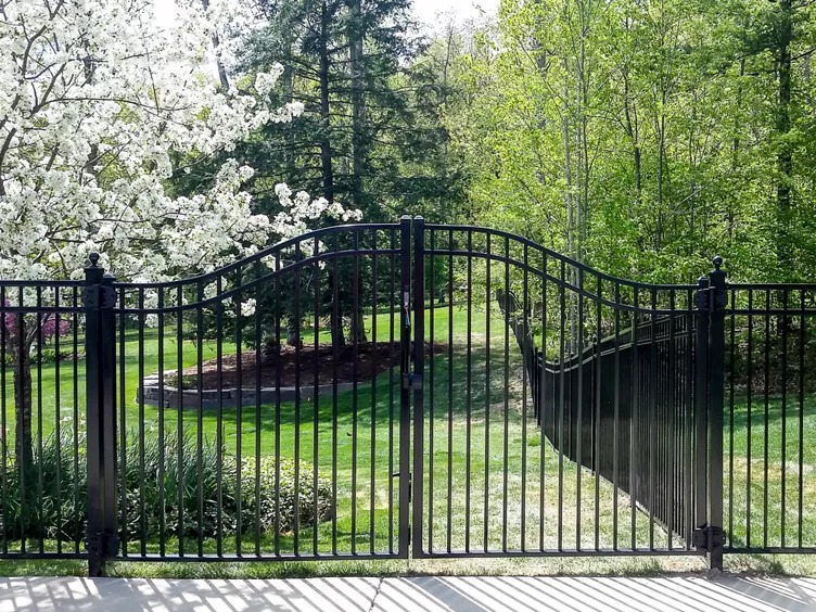 Custom iron gate install in Leawood by RKC Wood Care Pros