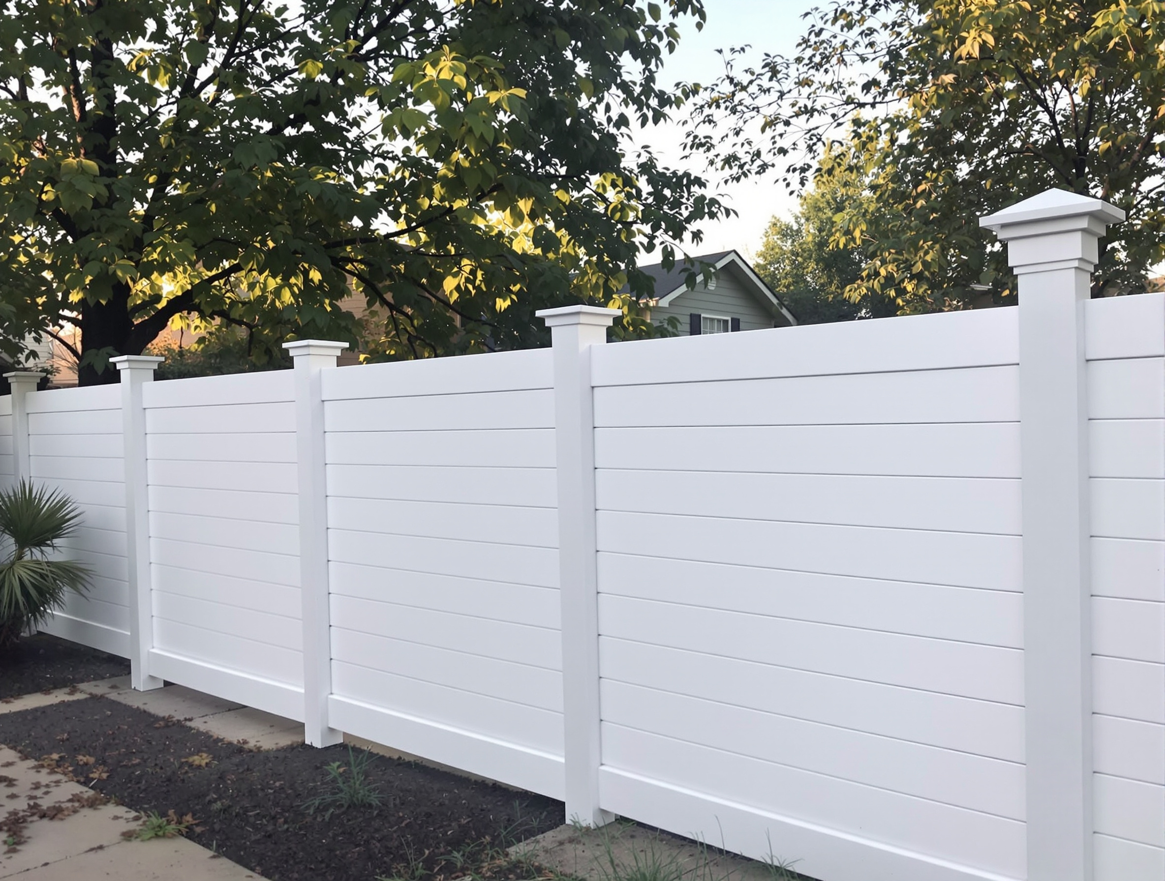 Modern horizontal plank vinyl fence with UV-stabilized co-extrusion finish in Kansas City — RKC Wood Care Pros