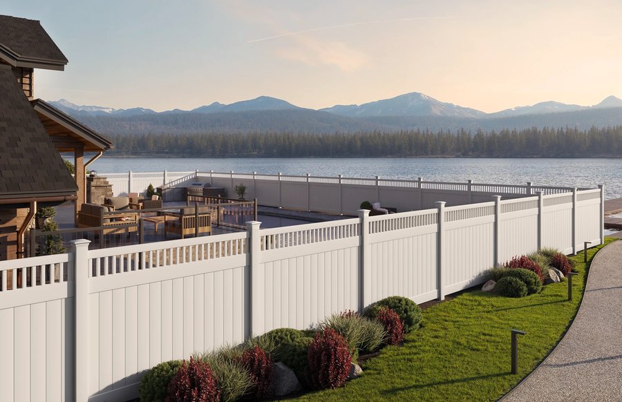 White vinyl privacy fence with lattice-top panels at a lakeside property — RKC Wood Care Pros
