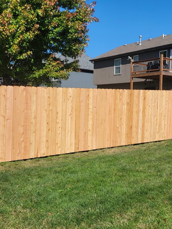 Cedar dog-ear picket privacy fence backyard install in Kansas City — RKC Wood Care Pros