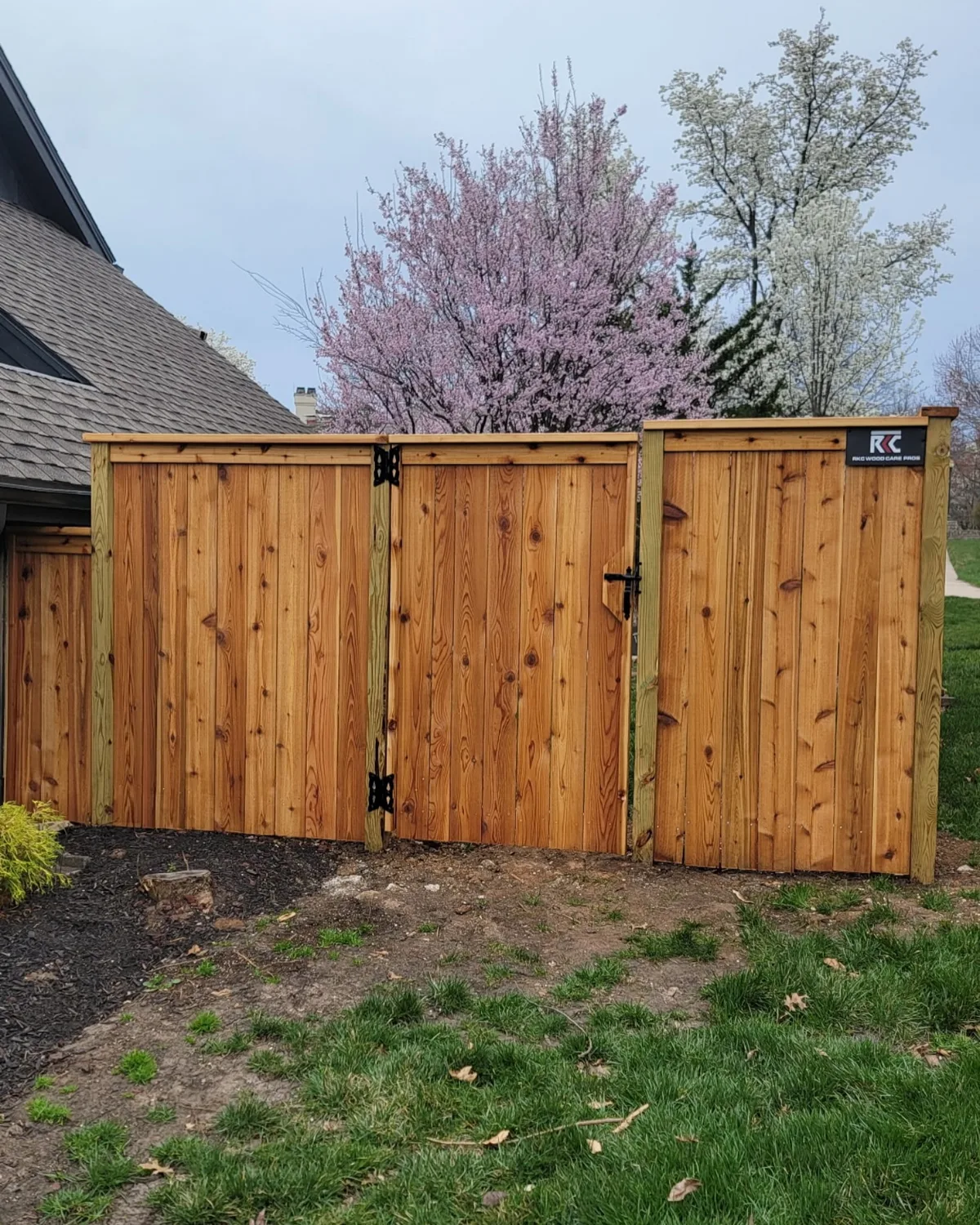 Corner view of cedar fence with consistent board spacing in Olathe, KS residential backyard