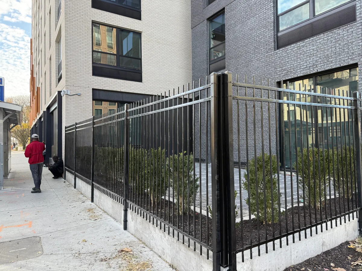 Detail of black ornamental iron fence panels and gates at a Kansas City, MO multi-family property