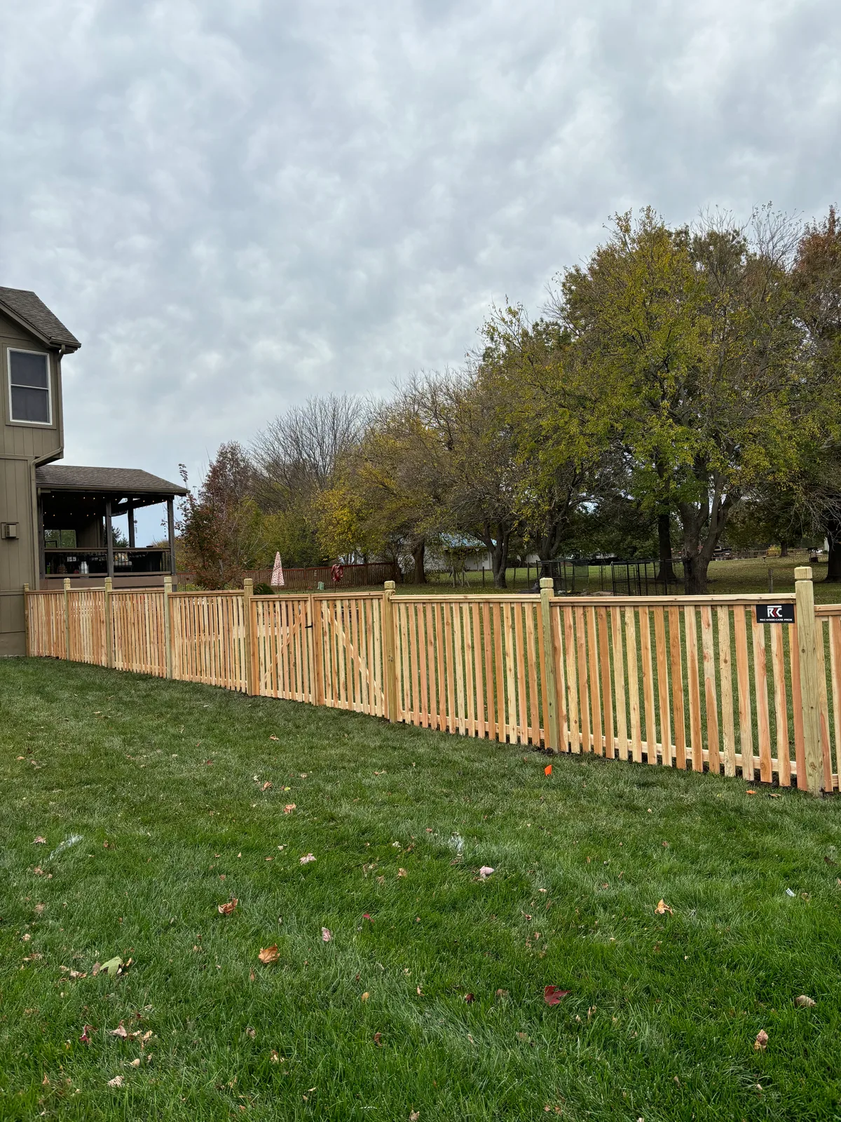 Close horizontal slat detail on new cedar privacy fence in Gardner, KS